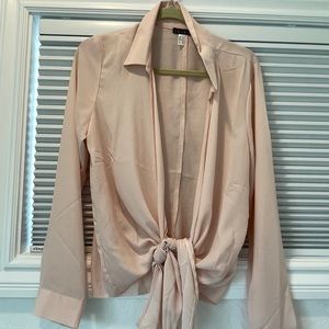 Light pink wrap blouse.